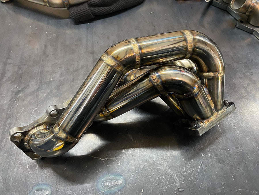 DarkLight Fabrication 1.6L Miata turbo exhaust manifold for boosted builds