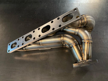 BMW E30 M42 turbo manifold featuring precision TIG welds by DarkLight Fabrication